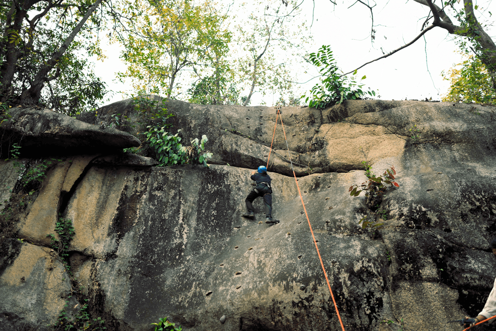 Rappelling down the rock face