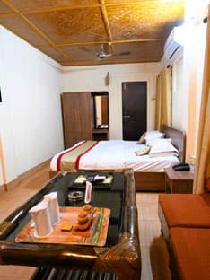 A room beneath a carved wooden ceiling