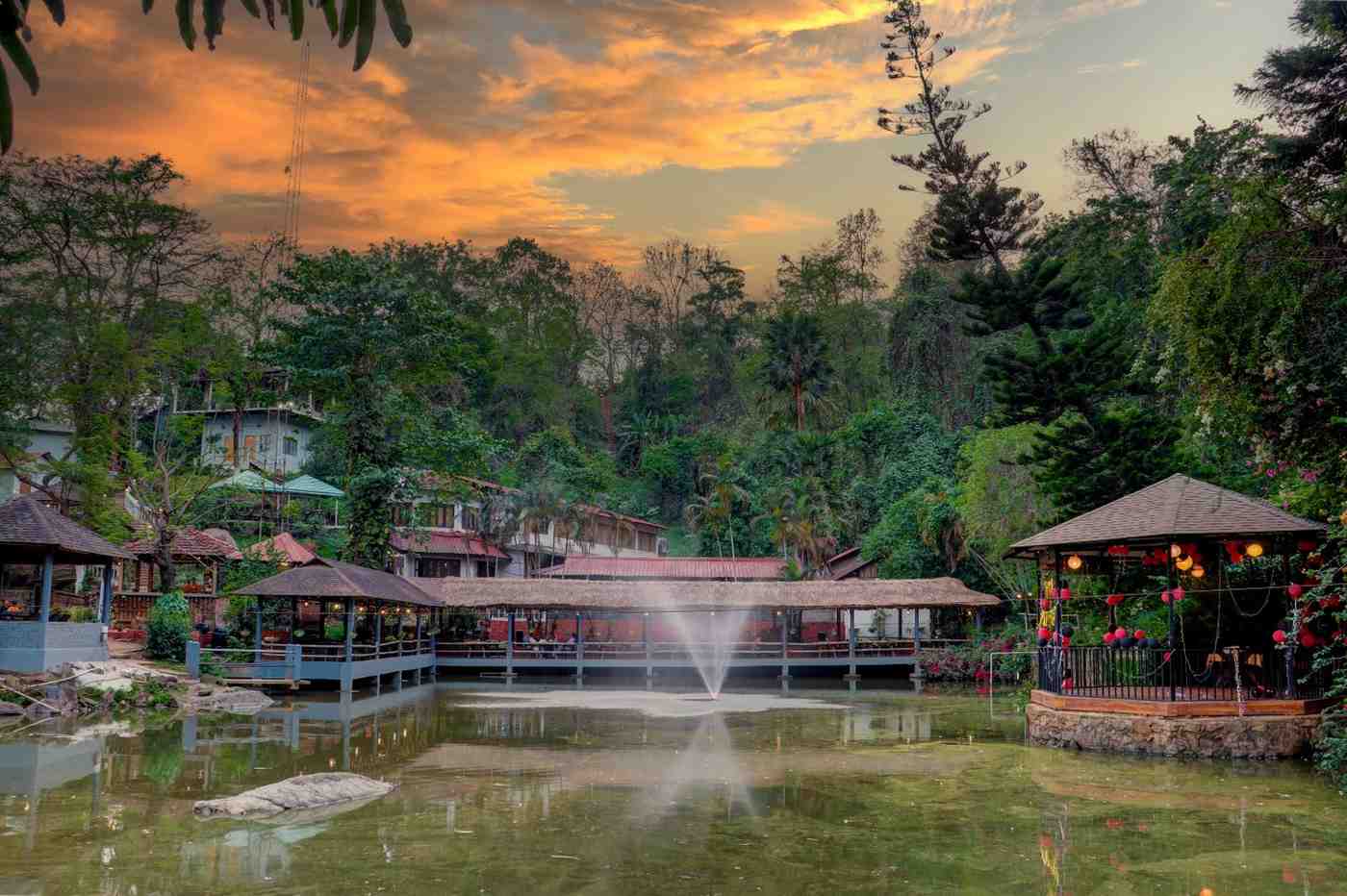 The resort pond, gazebo and fountain at sunset